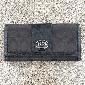 Standard size coach women’s wallet black canvas outside real leather inside